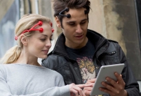 A couple wearing Foc.us devices